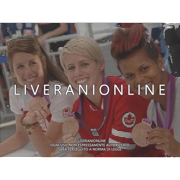(120816) -- VANCOUVER, Aug. 16, 2012 () -- London Olympic Bronze medallist Canadian soccer players Emily Zurrer (L), Sophie Schmidt (C) and Karina LeBlanc pose for a photograph before the Vancouver Whitecaps soccer game against FC Dallas in MLS soccer action at B.C. Place Stadium, in Vancouver, Canada, on August 15, 2012. (/Sergei Bachlakov) ©photoshot/Agenzia Aldo Liverani Sas - ITALY ONLY - Le calciatrici canadesi bronzo olimpico a Londra al BC Place Stadium, a Vancouver, in Canada, il 15 agosto 2012.