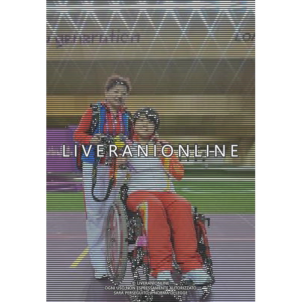 (120830) -- LONDON, Aug. 30, 2012 () -- Zhang Cuiping (R) of China poses with her coach Wang Ping after the awarding ceremony for the final of the Women\'s R2-10m Air Rifle Standing-SH1 shooting event at London 2012 Paralympic Games in London, Britain, on Aug. 30, 2012. Zhang took the gold medal with 500.9 rings. (/Wang Haofei) (zc) /photoshot/AG ALDO LIVERANI SAS ITALY ONLY -