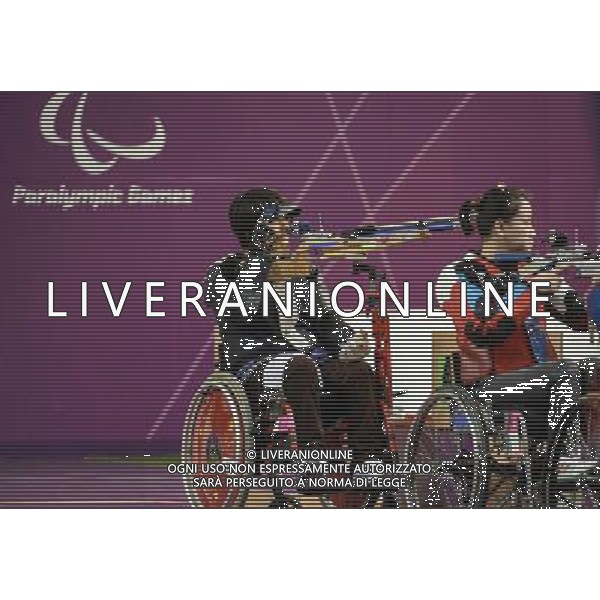 (120830) -- LONDON, Aug. 30, 2012 () -- Zhang Cuiping (L) of China competes during the final of the Women\'s R2-10m Air Rifle Standing-SH1 shooting event at London 2012 Paralympic Games in London, Britain, on Aug. 30, 2012. Zhang took the gold medal with 500.9 rings. (/Wang Haofei) (zc) /photoshot/AG ALDO LIVERANI SAS ITALY ONLY -