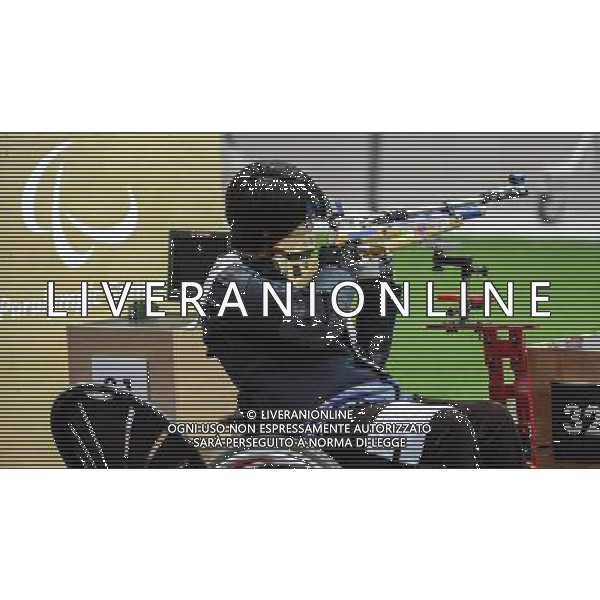 (120830) -- LONDON, Aug. 30, 2012 () -- Zhang Cuiping of China competes during the qualification match of the Women\'s R2-10m Air Rifle Standing-SH1 shooting event at London 2012 Paralympic Games in London, Britain, on Aug. 30, 2012. Zhang ranked 1st with 396 rings and advanced into the final. (/Wang Haofei) (zc) /photoshot/AG ALDO LIVERANI SAS ITALY ONLY -
