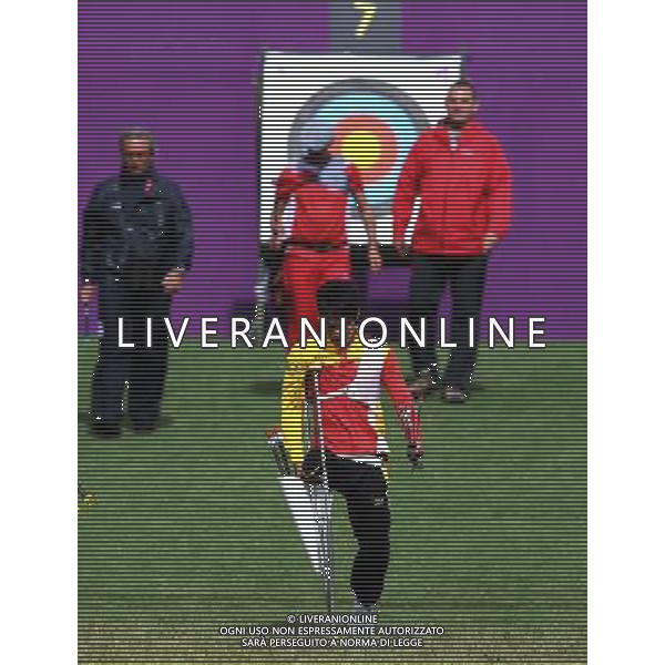 (120830) -- LONDON, Aug. 30, 2012 () -- Li Zongshan (Front) of China walks back to the position after checking his result during the the men\'s archery individual recurve standing ranking round at London 2012 Paralympic Games in London, Britain, on Aug. 30, 2012. Li ranked 10th with 605 rings. (/Wang Lili) (zc) /photoshot/AG ALDO LIVERANI SAS ITALY ONLY -