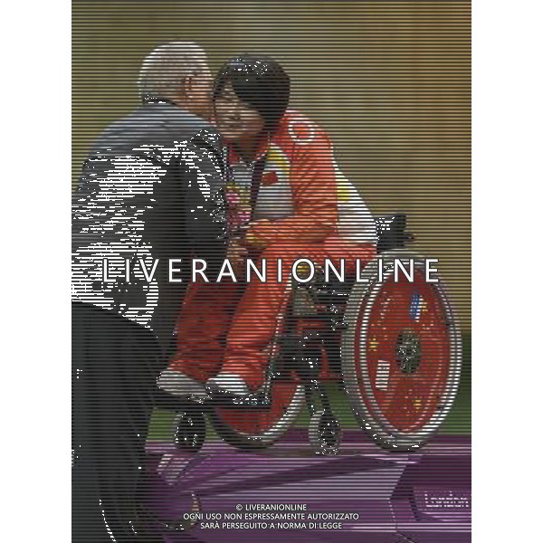 (120830) -- LONDON, Aug. 30, 2012 () -- Zhang Cuiping (R) of China is congratulated during the final of the Women\'s R2-10m Air Rifle Standing-SH1 shooting event at London 2012 Paralympic Games in London, Britain, on Aug. 30, 2012. Zhang took the gold medal with 500.9 rings. (/Wang Haofei) (zc) /photoshot/AG ALDO LIVERANI SAS ITALY ONLY -