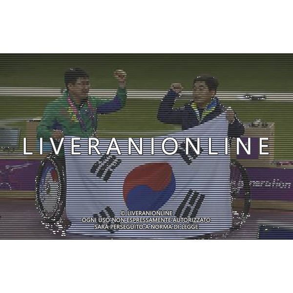 (120830) -- LONDON, Aug. 30, 2012 () -- Park Seayun (R) and his teammate Lee Juhee of South Korea celebrate during the Men\'s P1-10m Air Pistol-SH1 shooting event at London 2012 Paralympic Games in London, Britain, on Aug. 30, 2012. Park Seayun took the gold medal with 664.7 rings. (/Li Jundong) (cc) /photoshot/AG ALDO LIVERANI SAS ITALY ONLY -