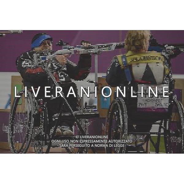 (120831) -- LONDON, Aug. 31, 2012 () -- Josef Neumaier (L) of Germany competes during the men\'s R1-10m Air Rifle Standing-SH1 final of the shooting event at the London 2012 Paralympic Games, Aug. 31, 2012. Neumaier took the bronze medal with 693.4 rings. (/Wang Haofei) (zc) AG ALDO LIVERANI S A S ONLY ITALY