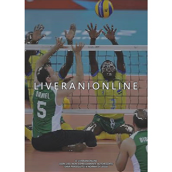 (120831) -- LONDON, Aug. 31, 2012 () -- Vincent Tuyisenge (R) of Rwanda blocks the net during the men\'s sitting volleyball preliminary round match against Rwanda at the London 2012 Paralympic Games, Aug. 31, 2012. Brazil won 3-0. (/Chen Yehua) (zc) AG ALDO LIVERANI S A S ONLY ITALY