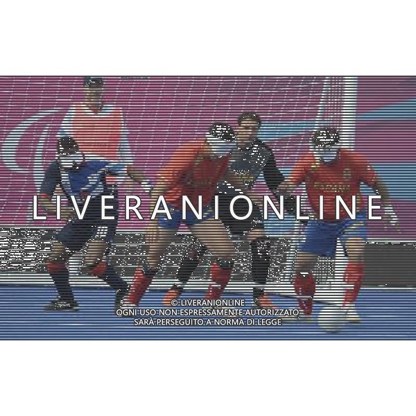 (120901) -- LONDON, Sept. 1, 2012 () -- Alfredo Cuadrado Freire (R) of Spain breaks through during the men\'s football 5-a-side preliminaries Pool A match against Britain at London 2012 Paralympic Games in London, Aug. 31, 2012. (/Li Jundong) AG ALDO LIVERANI S A S ONLY ITALY