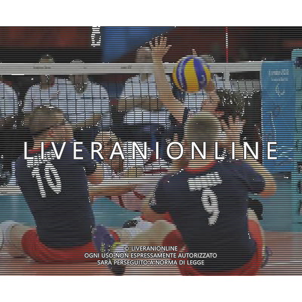 (120901) -- LONDON, Sept. 1, 2012 () -- Ashraf Zaghloul Abdel Aziz (C) of Egypt spikes the ball during the men\'s sitting volleyball preliminary round Pool A match against Britain at London 2012 Paralympic Games in London, Aug. 31, 2012. (/Chen Yehua) AG ALDO LIVERANI S A S ONLY ITALY