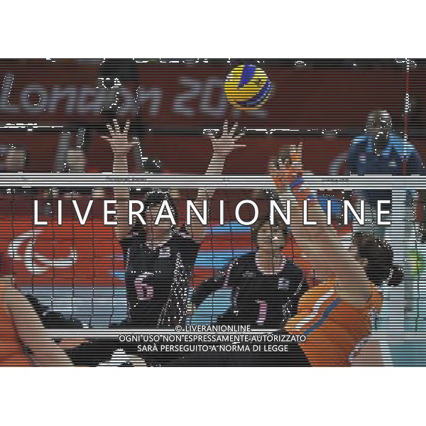 (120901) -- LONDON, Sept. 1, 2012 () -- Shiori Ogata of Japan bolcks the ball during the women\'s sitting volleyball preliminary round Pool A match against the Netherlands at London 2012 Paralympic Games in London, Aug. 31, 2012. Japan lost the match 1-3. (/Chen Yehua) AG ALDO LIVERANI S A S ONLY ITALY