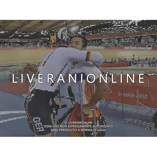 (120901) -- LONDON, Sept. 1, 2012 () -- Gold medalist Liang Guihua (R) of China and silver medalist Tobias Graf of Germany hus each other after the men\'s individual C2 Pursuit final at London 2012 Paralympic Games in London, Aug. 31, 2012. (/Wu Wei) AG ALDO LIVERANI S A S ONLY ITALY