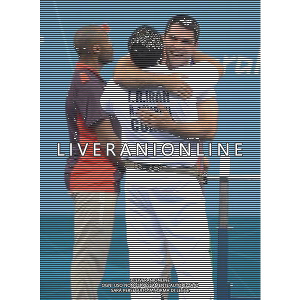 (120902) -- LONDON, Sept. 2, 2012 () -- Nader Moradi of Iran hugs his coach after winning the Men\'s 60 kg final of the Powerlifting event at London 2012 Paralympic Games in London, Britain, on Sept. 1, 2012. Moradi won the gold medal with 196kg. (/Li Xiaoguo) (cc) AG ALDO LIVERANI S A S ONLY ITALY