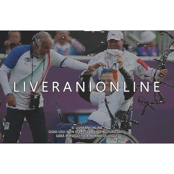 (120902) -- LONDON, Sept. 2, 2012 () -- David Drahoninsky (R) of the Czech Republic gestures after winning the Men\'s Individual Compound - W1 Quarterfinals against Fabio Azzolini of Italy, at London 2012 Paralympic Games, in London, on Sept. 1, 2012. Drahoninsky won 6-5, and advanced to the semifinals. (/Wang Lili) (cc) AG ALDO LIVERANI S A S ONLY ITALY