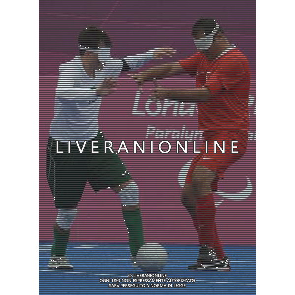 (120902) -- LONDON, Sept. 2, 2012 () -- Ricardo Steinmetz Alves (L) of Brazil vies with Ali Cavdar of Turkey during the Pool B preliminary of Men\'s football 5-a-side at the London 2012 Paralympic Games in London, Britain, Sept. 2, 2012. Brazil won 4-0. (/Li Jundong) (lm) PHOTOSHOT/AG ALDO LIVERANI SAS - ITALY ONLY -
