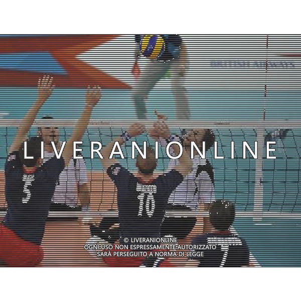 (120903) -- LONDON, Sept. 3, 2012 () -- Alexander Schiffler (Back R) of Germany spikes the ball during the Pool A preliminary round of men\'s sitting volleyball against Great Britain at the London 2012 Paralympic Games in London, Britain, Sept. 3, 2012. Germany won 3-0. (/Chen Yehua) ©PHOTOSHOT/AGENZIA ALDO LIVERANI SAS - ITALY ONLY - PARALIMPIADI LONDRA 2012