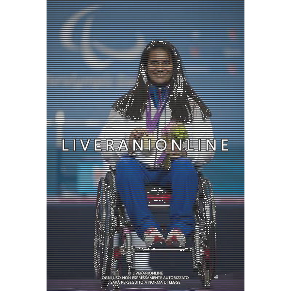 (120903) -- LONDON, Sept. 3, 2012 () -- Souhad Ghazouani of France poses during the awarding ceremony after the women\'s 67.5kg powerlifting final at London 2012 Paralympic Games in London, Britain, Sept. 3, 2012. Ghazouani won the gold medal and set a new Paralympic record with 146kg. (/Liu Siu Wai) ©PHOTOSHOT/AGENZIA ALDO LIVERANI SAS - ITALY ONLY - PARALIMPIADI LONDRA 2012