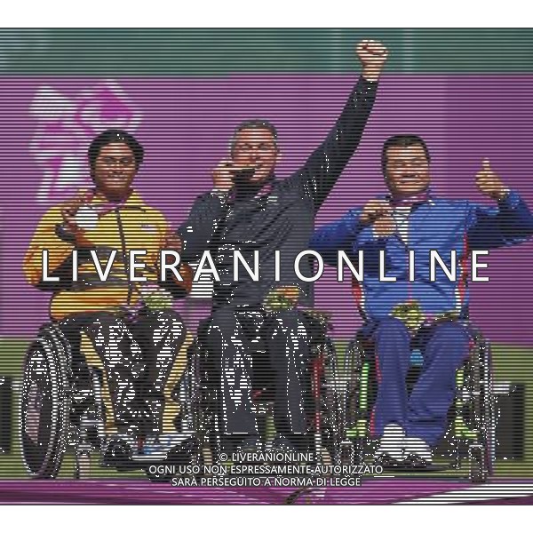 (120903) -- LONDON, Sept. 3, 2012 () -- Oscar de Pellegrin (C) of Italy poses during the awarding ceremony of the men\'s individual recurve W1/W2 final of archery competition at the London 2012 Paralympic Games in London, Britain, Sept. 3, 2012. Oscar de Pellegrin won 6-5 in the final to take the gold medal. Hasihin Sanawi (L) of Malaysia took the silver medal and Tseng Lung Hui of Chinese Taipei took the bronze medal. (/Wang Lili) (cc) ©PHOTOSHOT/AGENZIA ALDO LIVERANI SAS - ITALY ONLY - PARALIMPIADI LONDRA 2012