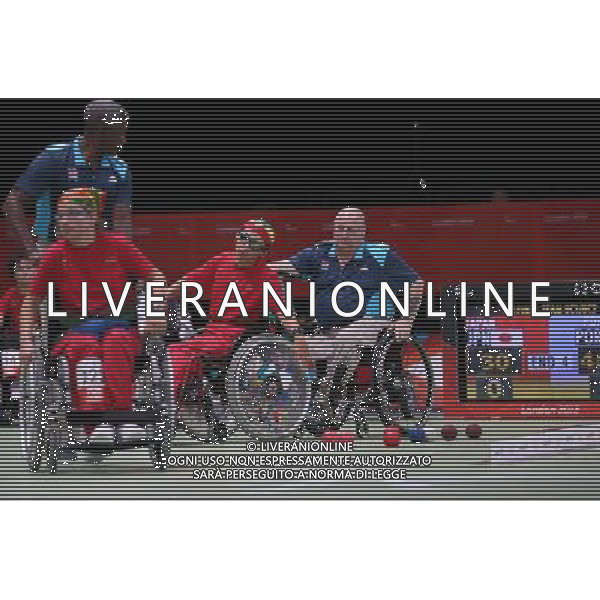 (120904) -- LONDON, Sept. 4, 2012 () -- The technical official Peter Edwards of England helps the player to move foward during a boccia competition at the London 2012 Paralympic Games, Sept. 3, 2012. Edwards who was born with perthes disease is one of the disabled officials at the London 2012 Paralympic Games. The disabled are not only the competitors but also technical officials, volunteers, referees during the event. (/Hou Jun) photoshot/AG ALDO LIVERANI SAS - ITALY ONLY - *** Local Caption *** ..