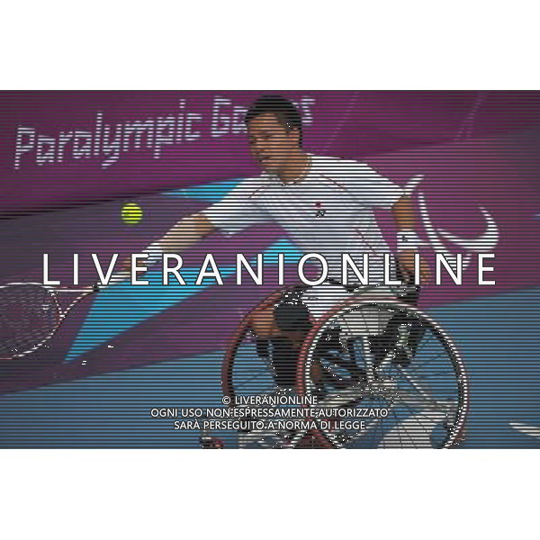 (120905) -- LONDON , Sept. 4, 2012 () -- Takashi Sanada of Japan returns the ball to Gustavo Fernandez of Argentina during the men\'s singles 3rd round match of wheelchair tennis competition at the London 2012 Paralympic Games in London, Britain, on Sept. 4, 2012. Takashi Sanada lost 1-2.(/Chen Yehua) (lm) photoshot/AG ALDO LIVERANI SAS - ITALY ONLY - *** Local Caption *** ..