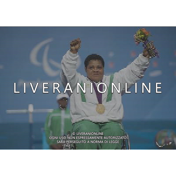 (120904) -- LONDON, Sept. 4, 2012 () -- Loveline Obiji of Nigeria poses during the awarding ceremony of the Women\'s 82.50 kg powerlifting competition at the London 2012 Paralympic Games in London, Britain, on Sept. 4, 2012. Loveline Obiji took the gold medal with 145 kg. (/Lui Siu Wai) photoshot/AG ALDO LIVERANI SAS - ITALY ONLY - *** Local Caption *** ..