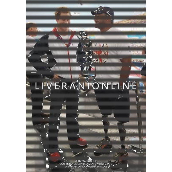 Prince Harry meets former soldier and Paralympic athlete Derek Derenalagi at a visit to the Aquatics Centre where he watched swimming heats with Team GB swimmers during the London 2012 Paralympic Games at the Olympic Park this morning. PHOTOSHOT/AG ALDO LIVERANI SAS - ITALY ONLY -