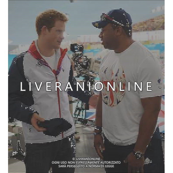 Prince Harry meets former soldier and Paralympic athlete Derek Derenalagi at a visit to the Aquatics Centre where he watched swimming heats with Team GB swimmers during the London 2012 Paralympic Games at the Olympic Park this morning. PHOTOSHOT/AG ALDO LIVERANI SAS - ITALY ONLY -