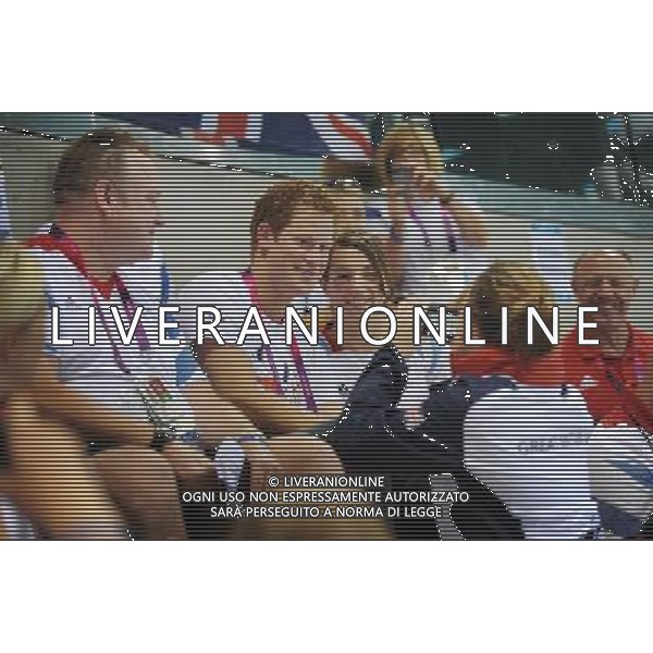 Prince Harry poses for photographs with Team GB swimmers when he visited the Aquatics Centre during the London 2012 Paralympic Games at the Olympic Park this morning. PHOTOSHOT/AG ALDO LIVERANI SAS - ITALY ONLY -