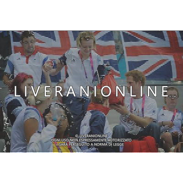 Prince Harry helps Team GB swimmer Hannah Russell to her seat when he visited the Aquatics Centre during the London 2012 Paralympic Games at the Olympic Park this morning. PHOTOSHOT/AG ALDO LIVERANI SAS - ITALY ONLY -
