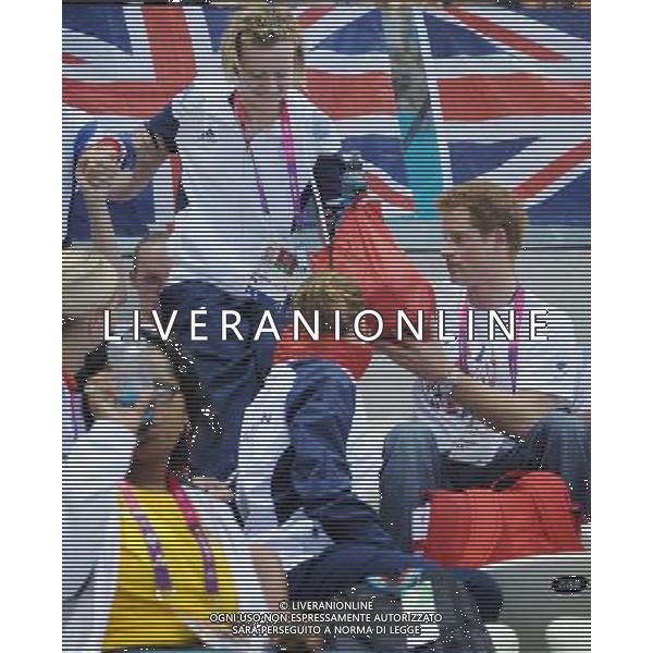 Prince Harry helps Team GB swimmer Hannah Russell to her seat when he visited the Aquatics Centre during the London 2012 Paralympic Games at the Olympic Park this morning. PHOTOSHOT/AG ALDO LIVERANI SAS - ITALY ONLY -