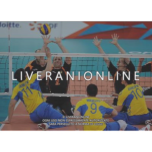 (120905) -- LONDON, Sept. 5, 2012 () -- Jurgen Schrapp (3rd L) of Germany block the net together with his teammate during the men\'s sitting volleyball quarterfinal against China at the London 2012 Paralympic Games in London, Britain, on Sept. 5, 2012. Germany beat China 3-2. (/Chen Yehua) (zc) PHOTOSHOT-AG ALDO LIVERANI SAS - ITALY ONLY