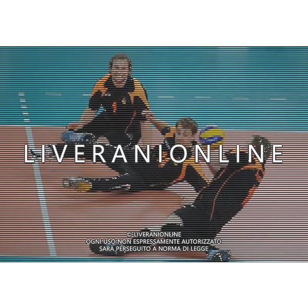(120905) -- LONDON, Sept. 5, 2012 () -- Christoph Herzog (Bottom) of Germany digs the ball during the men\'s sitting volleyball quarterfinal against China at the London 2012 Paralympic Games in London, Britain, on Sept. 5, 2012. Germany beat China 3-2. (/Chen Yehua) (zc) PHOTOSHOT-AG ALDO LIVERANI SAS - ITALY ONLY