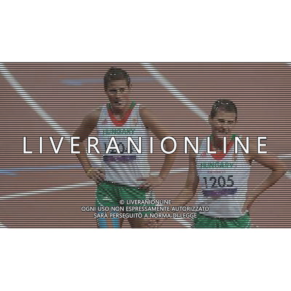 (120906) -- LONDON , Sept. 6, 2012 () -- Ilona Biacsi (R) and Bernadett Biacsi of Hungary react after the women\'s 1500m T20 final of athletics competition at the London 2012 Paralympic Games in London, Britain, on Sept. 5, 2012. Ilona Biacsi and Bernadett Biacsi took the 3rd and 4th place respectively. (/Wang Haofei) (lm) PHOTOSHOT-AG ALDO LIVERANI SAS - ITALY ONLY