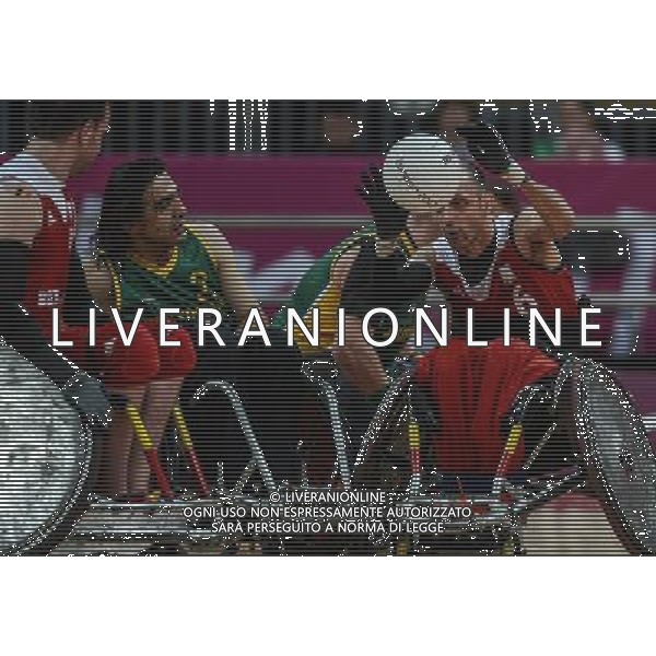(120907) -- LONDON, Sept. 7, 2012 () -- Duquenne David (1st R) of Belgium passes the ball during the mixed wheelchair rugby Pool Phase Group B match against Australia at the London 2012 Paralympic Games in London, Britain, on Sept. 7, 2012. Belgium lost the match 43-58. (/Wang Haofei) (zc) PHOTOSHOT/AG ALDO LIVERANI SAS ITALY ONLY