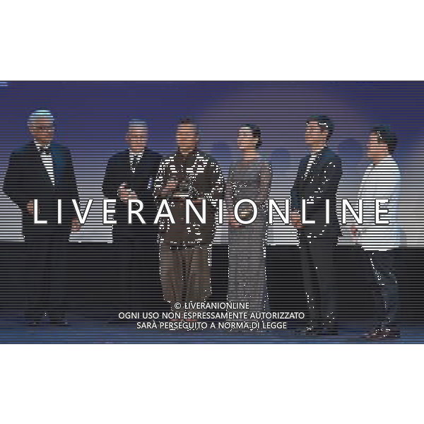 (120908) -- VENICE, Sept. 8, 2012 () -- South Korean director Kim Ki-duk (3rd L) is awarded the Golden Lion for Best Film for his film \'Pieta\' at the awarding ceremony of the 69th Venice International Film Festival in Venice, Italy, Sept. 8, 2012. (/Wang Qingqin) PHOTOSHOT/AG ALDO LIVERANI SAS - ITALY ONLY -