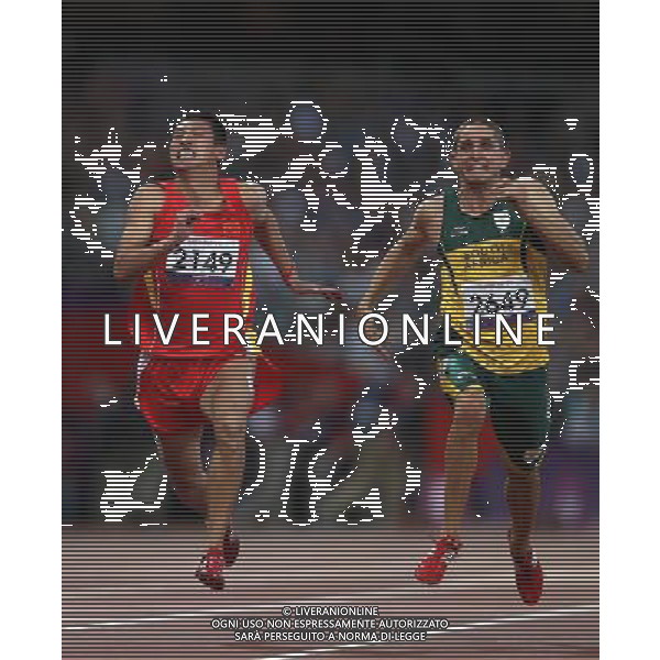 (120909) -- LONDON, Sept. 9, 2012 () -- Liang Yongbin (L) of China and Fanie van der Merwe of South Africa compete during the men\'s 100m T37 final of athletics competition at the London 2012 Paralympic Games in London, Britain, on Sept. 8, 2012. (/Wang Lili) (lm) PHOTOSHOT/AG ALDO LIVERANI SAS - ITALY ONLY -