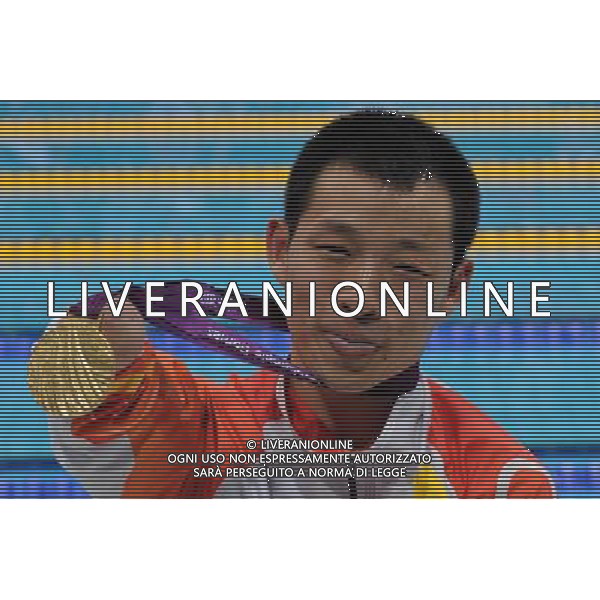(120909) -- LONDON, Sept. 9, 2012 () -- Xu Qing of China poses with the gold medal after the awarding ceremony of the men\'s 100m freestyle S6 final of swimming competition at the London 2012 Paralympic Games in London, Britain, on Sept. 8, 2012. Xu Qing won the gold medal with 1 minute and 05.82 seconds. (/Yang Shiyao) (lm) PHOTOSHOT/AG ALDO LIVERANI SAS - ITALY ONLY -