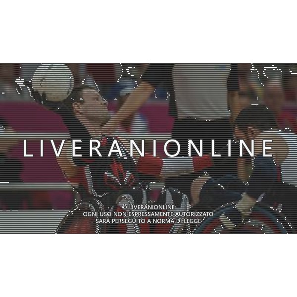 (120909) -- LONDON, Sept. 9, 2012 () -- Fabien Lavoie (L) of Canada competes during the mixed wheelchair rugby semifinal against the United States at the London 2012 Paralympic Games in London, Britain, on Sept. 8, 2012. Canada won 50-49. (/Wang Haofei) (lm) PHOTOSHOT/AG ALDO LIVERANI SAS - ITALY ONLY -