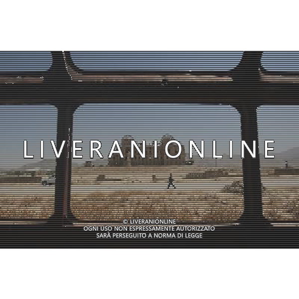 (120911) -- KABUL, Sept. 11, 2012 () -- An Afghan man walks in front of the destroyed Daralmine palace near TV mountain in Kabul, Afghanistan, Sept. 11, 2012. The TV mountain was one of the first targets where the U.S.-led international forces bombed Taliban in October 2001 in direct response to the attacks on U.S. soil on Sept. 11, 2001. (/Ahmad Massoud) (zyw) ©photoshot/AGENZIA ALDO LIVERANI SAS - ITALY ONLY - Vedute della citta\' di Kabul in Afghanistan, 11 settembre, 2012.