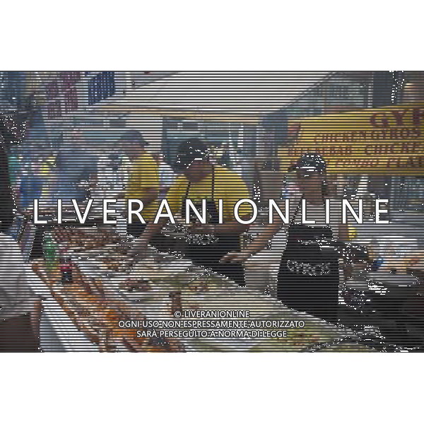 Brazilians and visitors enjoy non-Brazilian food at the 28th Annual Brazil Day Festival in New York on Sunday, September 2, 2012. The festival, which features food. music and other aspects of Brazilian culture, centers around West 46th Street in Midtown Manhattan, known as Little Brazil. (å Richard B. Levine) photoshot/AG ALDO LIVERANI SAS - ITALY ONLY -