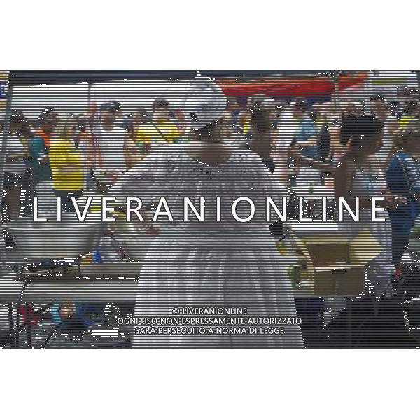 A food vendor fans herself at the 28th Annual Brazil Day Festival in New York on Sunday, September 2, 2012. The festival, which features food, music and other aspects of Brazilian culture, centers around West 46th Street in Midtown Manhattan, known as Little Brazil. (å Frances M. Roberts) photoshot/AG ALDO LIVERANI SAS - ITALY ONLY -