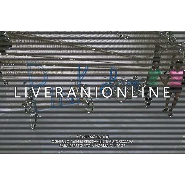 Newly installed bike racks, designed by former Talking Heads band member David Byrne, are seen in front of the Brooklyn Academy of Music on Saturday, August 25, 2012. The two sets of racks spell out the words in steel, \'pink crown\' and \'micro lip\'. Byrne, an avid cyclist also designed bike racks for the Dept. of Transportation in 2008. (å Richard B. Levine) ©photoshot/AGENZIA ALDO LIVERANI SAS - ITALY ONLY - EDITORIAL USE ONLY