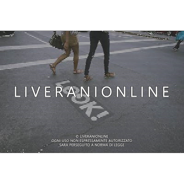 A directional sign on a sidewalk in New York informs pedestrians of the flow of traffic at an intersection, seen on Sunday, September 3, 2012. (å Richard B. Levine) ©photoshot/AGENZIA ALDO LIVERANI SAS - ITALY ONLY - EDITORIAL USE ONLY