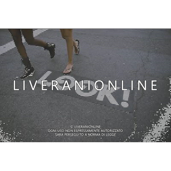 A directional sign on a sidewalk in New York informs pedestrians of the flow of traffic at an intersection, seen on Sunday, September 3, 2012. (å Richard B. Levine) ©photoshot/AGENZIA ALDO LIVERANI SAS - ITALY ONLY - EDITORIAL USE ONLY