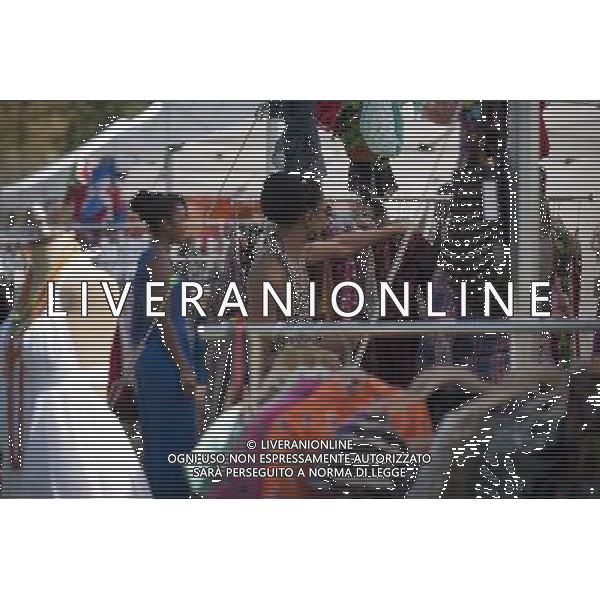 Shoppers at the AfroPunk Festival in Commodore Barry Park in Brooklyn in New York on Sunday, August 26, 2012. The festival in the neighborhood of Fort Greene bills itself as the \'other black experience\' and blends the black punk and hardcore punk scenes. There is also a diverse aspect combining other minority groups, all dressed in their fashionable punk ensembles. (å Richard B. Levine) ©photoshot/AGENZIA ALDO LIVERANI SAS - ITALY ONLY - EDITORIAL USE ONLY