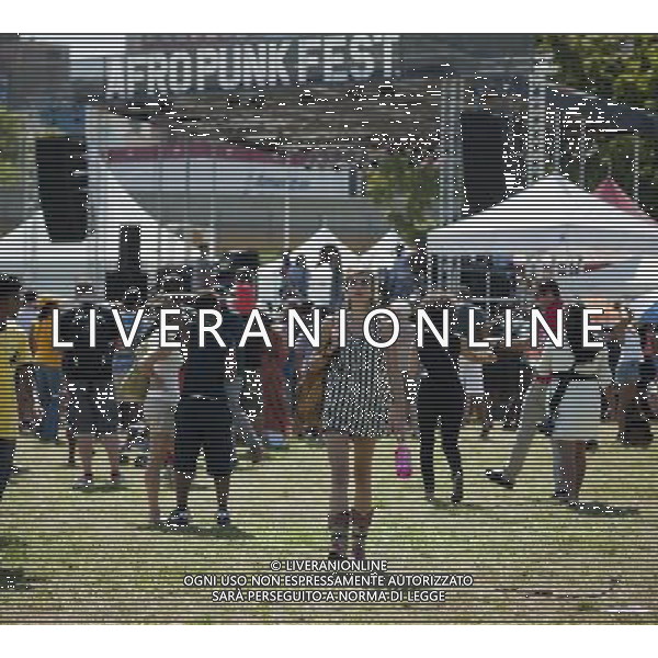 Visitors to the AfroPunk Festival in Commodore Barry Park in Brooklyn in New York on Sunday, August 26, 2012. The festival in the neighborhood of Fort Greene bills itself as the \'other black experience\' and blends the black punk and hardcore punk scenes. There is also a diverse aspect combining other minority groups, all dressed in their fashionable punk ensembles. (å Richard B. Levine) ©photoshot/AGENZIA ALDO LIVERANI SAS - ITALY ONLY - EDITORIAL USE ONLY