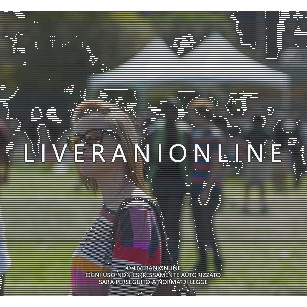 Visitors to the AfroPunk Festival in Commodore Barry Park in Brooklyn in New York on Sunday, August 26, 2012. The festival in the neighborhood of Fort Greene bills itself as the \'other black experience\' and blends the black punk and hardcore punk scenes. There is also a diverse aspect combining other minority groups, all dressed in their fashionable punk ensembles. (å Richard B. Levine) ©photoshot/AGENZIA ALDO LIVERANI SAS - ITALY ONLY - EDITORIAL USE ONLY