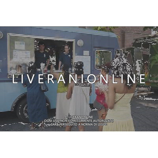 Hungry attendees to the AfroPunk Festival in Commodore Barry Park in Brooklyn in New York on Sunday, August 26, 2012 enjoy iced drinks from the Kelvin Slush truck at the food truck festival. The festival in the neighborhood of Fort Greene bills itself as the \'other black experience\' and blends the black punk and hardcore punk scenes. There is also a diverse aspect combining other minority groups, all dressed in their fashionable punk ensembles. (å Richard B. Levine) ©photoshot/AGENZIA ALDO LIVERANI SAS - ITALY ONLY - EDITORIAL USE ONLY