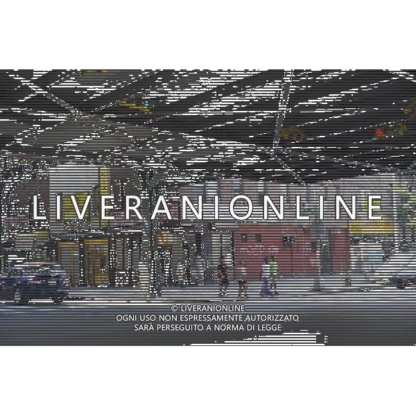 Pedestrians cross the street under the elevated subway tracks in the East New York neighborhood of Brooklyn in New York seen on Saturday, September 1, 2012. (å Frances M. Roberts) ©photoshot/AGENZIA ALDO LIVERANI SAS - ITALY ONLY - EDITORIAL USE ONLY