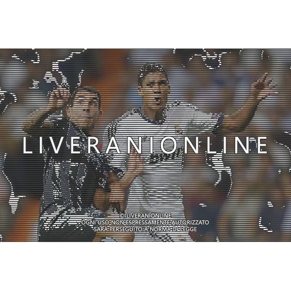 Real Madrid\'s Varane and Manchester City\'s Carlos Tevez during Champions League match on september 18th 2012. Photo: Cesar Cebola / ALFAQUI /Agenzia Aldo Liverani Sas - ITALY ONLY - EDITORIAL USE ONLY REAL MADRID - MANCHESTER CITY CHAMPIONS LEAGUE 18/09/2012