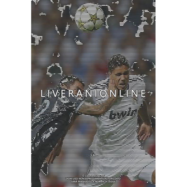 Real Madrid\'s Varane and Manchester City\'s Carlos Tevez during Champions League match on september 18th 2012. Photo: Cesar Cebola / ALFAQUI /Agenzia Aldo Liverani Sas - ITALY ONLY - EDITORIAL USE ONLY REAL MADRID - MANCHESTER CITY CHAMPIONS LEAGUE 18/09/2012