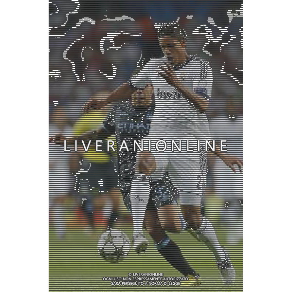 Real Madrid\'s Varane and Manchester City\'s Carlos Tevez during Champions League match on september 18th 2012. Photo: Cesar Cebola / ALFAQUI /Agenzia Aldo Liverani Sas - ITALY ONLY - EDITORIAL USE ONLY REAL MADRID - MANCHESTER CITY CHAMPIONS LEAGUE 18/09/2012