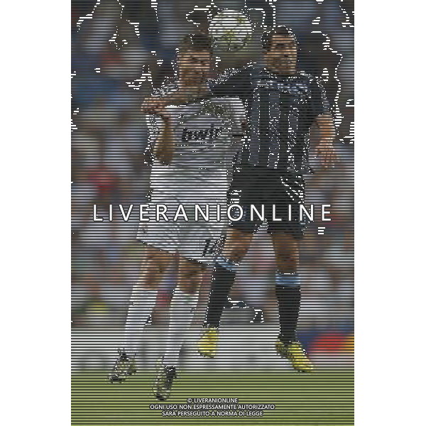 Real Madrid\'s Xabi Alonso and Manchester City\'s Carlos Tevez during Champions League match on september 18th 2012. Photo: Cesar Cebola / ALFAQUI /AGENZIA ALDO LIVERANI SAS - ITALY ONLY - EDITORIAL USE ONLY REAL MADRID - MANCHESTER CITY CHAMPIONS LEAGUE 18/09/2012